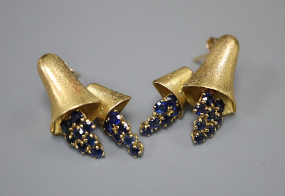 A pair of yellow metal (tests as 18ct) earrings of bell form set with sapphires, 24mm, gross 9.1 grams.